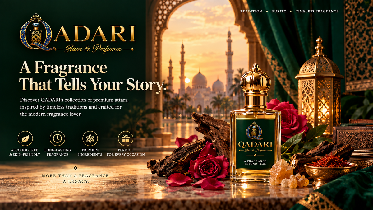 A bottle of QADARI Attar & Perfumes fragrance displayed on a marble surface with red roses, a brass lantern, and an ornate architectural backdrop featuring a sunset over domes. The bottle has a gold cap and a dark green label with gold lettering.